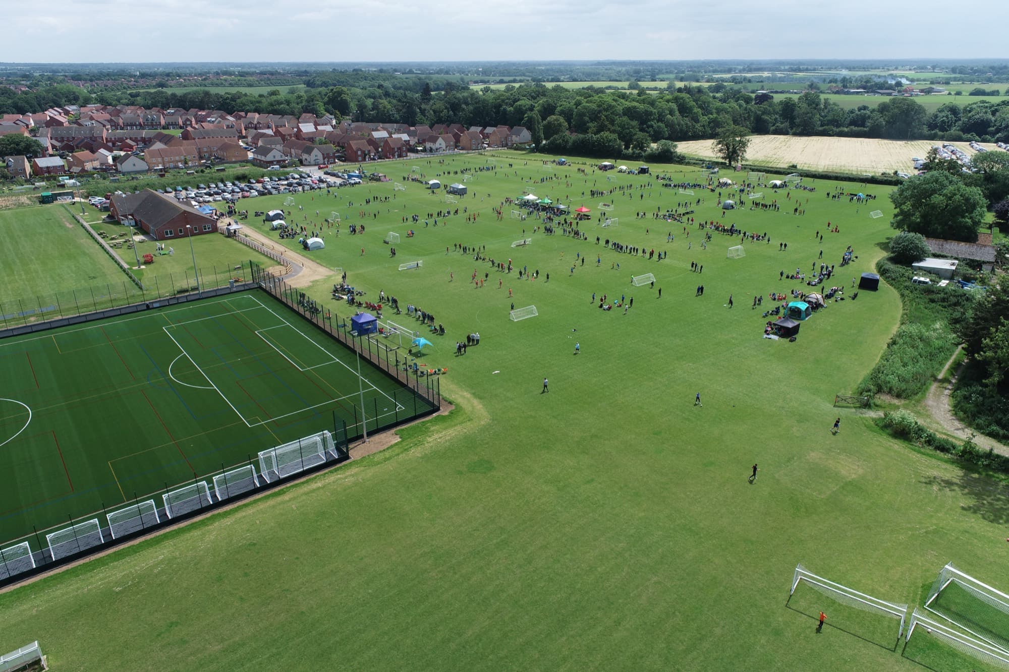 A grass pitch at Youngs Park on a summer afternoon
